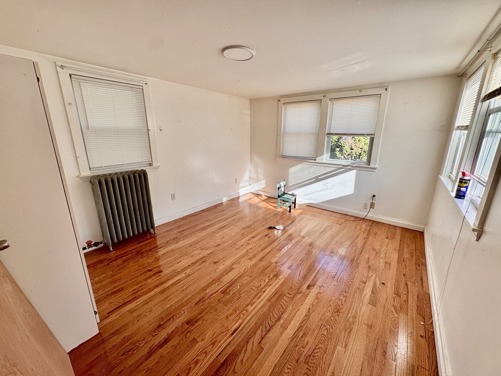 50 Mt Ararat Road, Unit 3 Quincy, MA 02169 - Photo 2 of 11 a view of a room with wooden floor and staircase