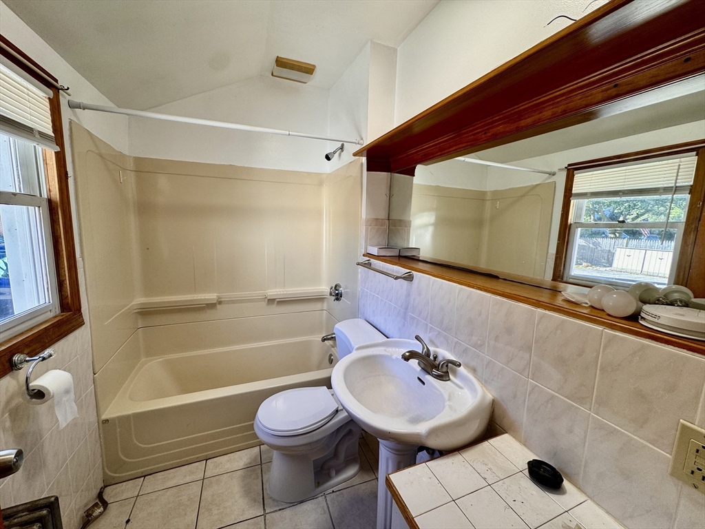 50 Mt Ararat Road, Unit 3 Quincy, MA 02169 - Photo 5 of 11 a bathroom with a sink a toilet and shower