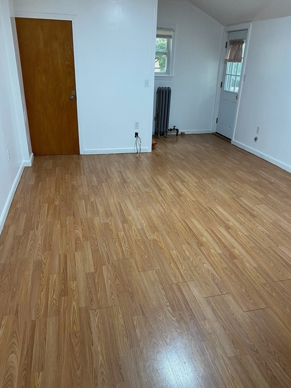 50 Mt Ararat Road, Unit 3 Quincy, MA 02169 - Photo 10 of 11 a view of empty room with wooden floor