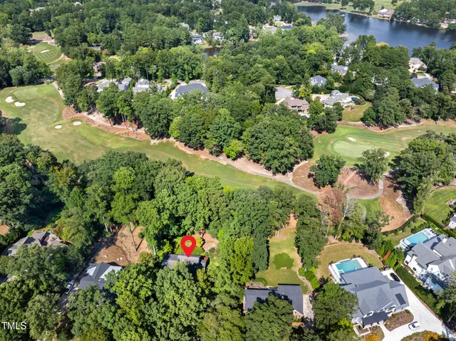 an aerial view of a houses with yard