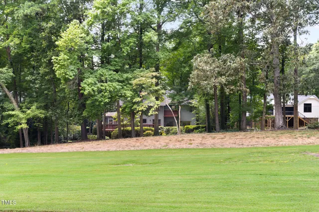 a view of a fountain in front of a house
