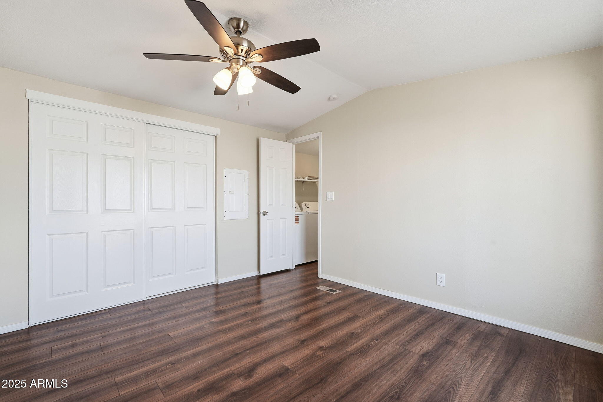 320 East McKellips Road, Unit 166 Mesa, AZ 85201 - Photo 11 of 24 a view of an empty room with wooden floor