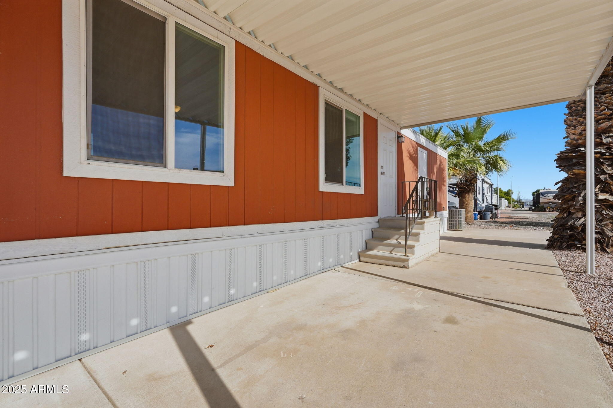 320 East McKellips Road, Unit 166 Mesa, AZ 85201 - Photo 19 of 24 a front view of a house with a garage