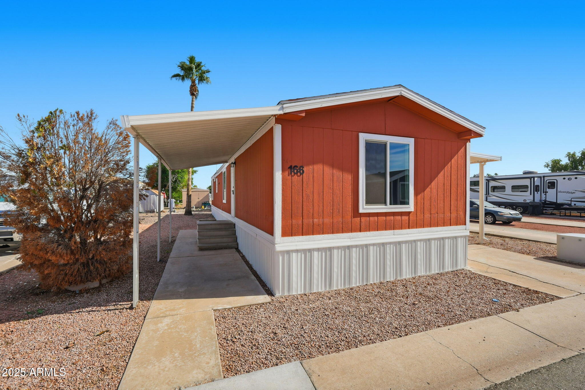 320 East McKellips Road, Unit 166 Mesa, AZ 85201 - Photo 24 of 24 a view of a house with a yard