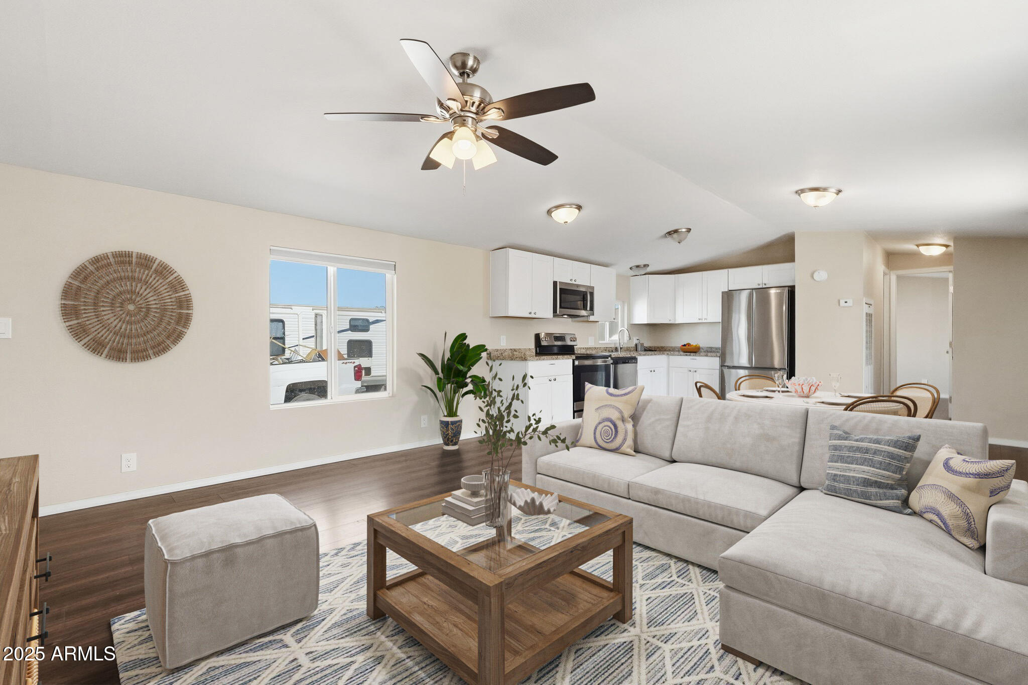 320 East McKellips Road, Unit 166 Mesa, AZ 85201 - Photo 7 of 24 a living room with furniture a rug and a wall painting