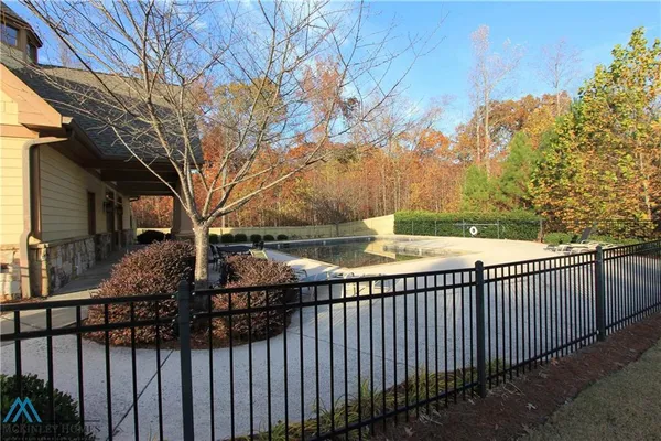 a view of a wrought iron fences in front of house