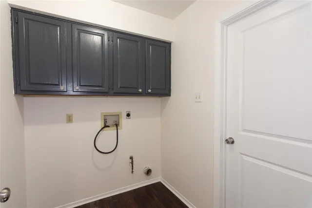 a view of a backyard with wooden fence
