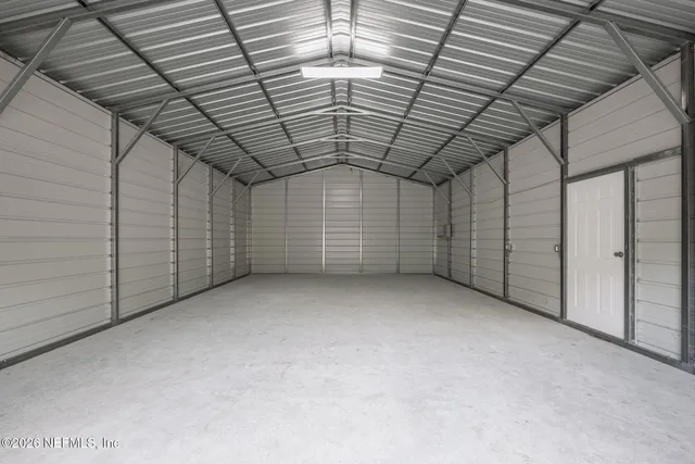 a front view of a house with a yard and seating space