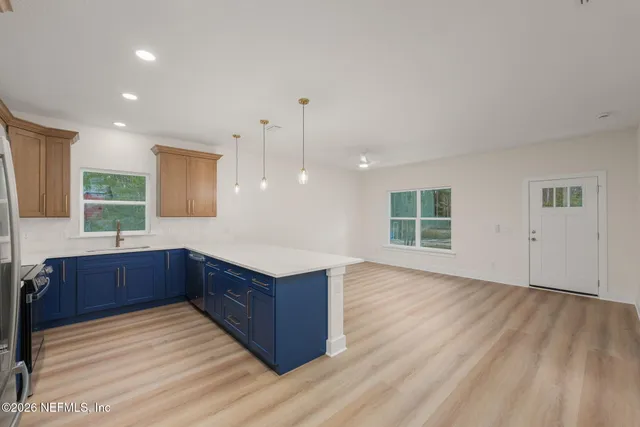 a bathroom with a sink and a window