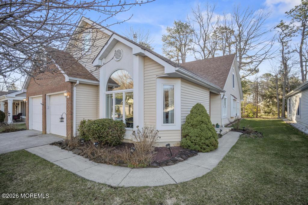 2287 Coral Leaf Road Toms River, NJ 08755 - Photo 1 of 38 a front view of a house with a yard