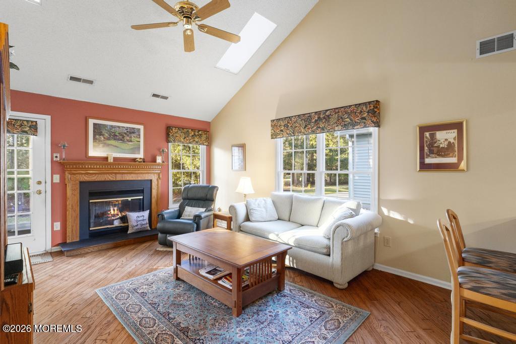 2287 Coral Leaf Road Toms River, NJ 08755 - Photo 16 of 38 a living room with furniture a rug and a fireplace
