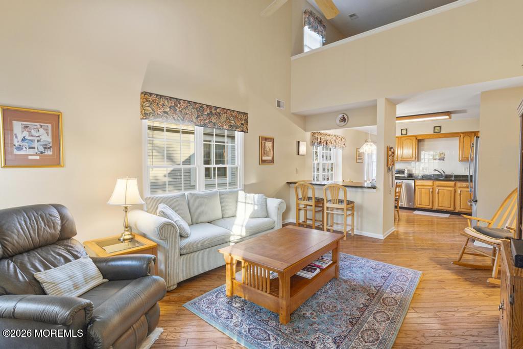 2287 Coral Leaf Road Toms River, NJ 08755 - Photo 19 of 38 a living room with furniture wooden floor and a large window