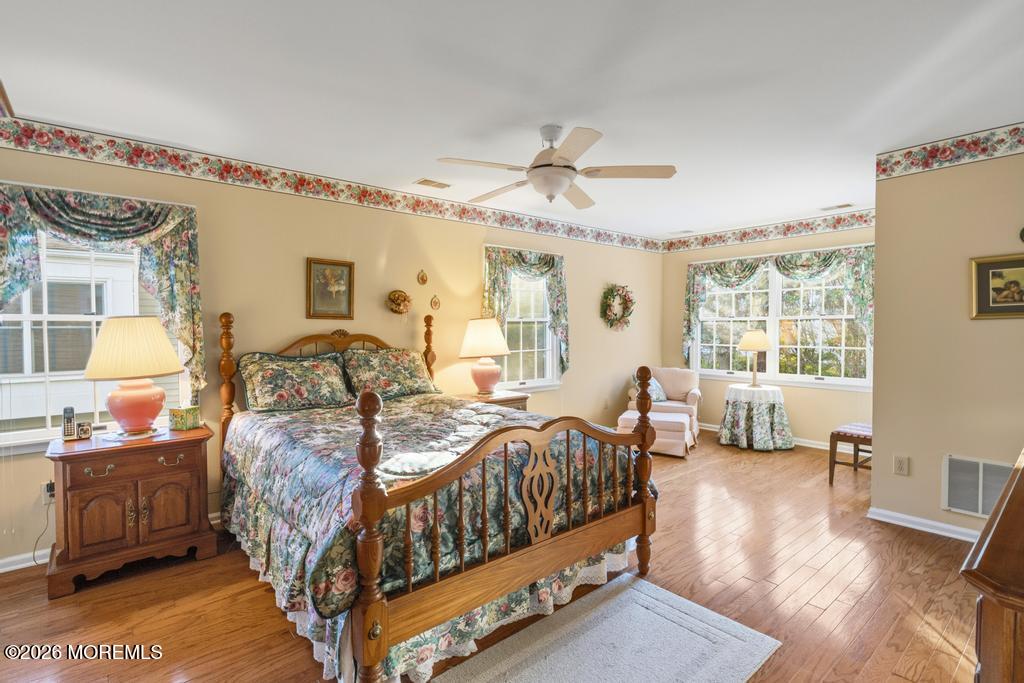 2287 Coral Leaf Road Toms River, NJ 08755 - Photo 20 of 38 a bedroom with a bed and wooden floor
