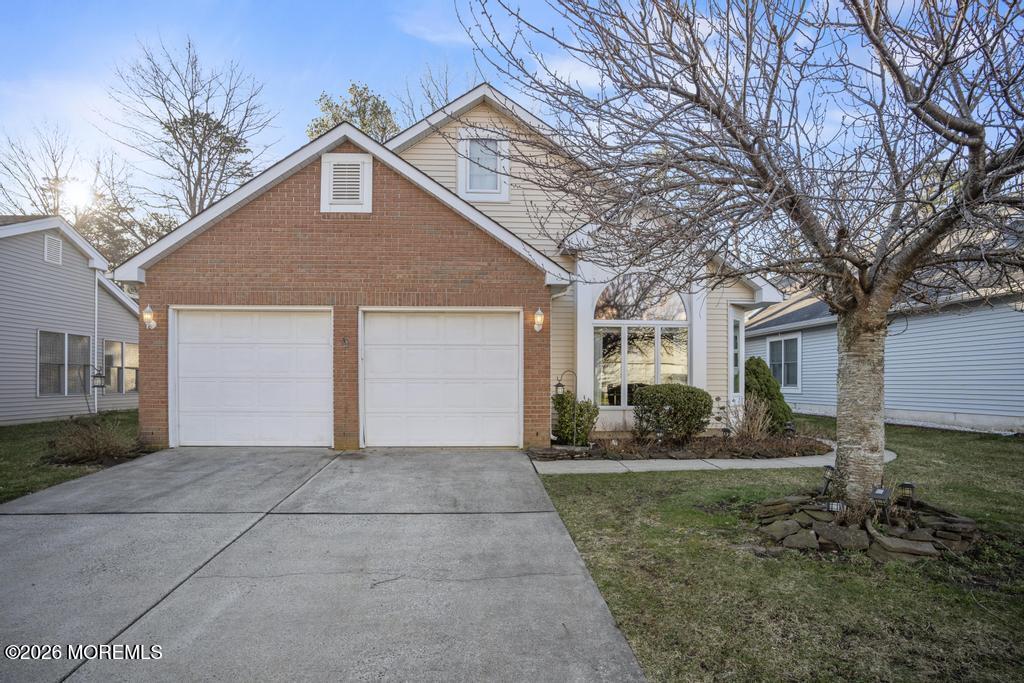 2287 Coral Leaf Road Toms River, NJ 08755 - Photo 2 of 38 a front view of a house with garden