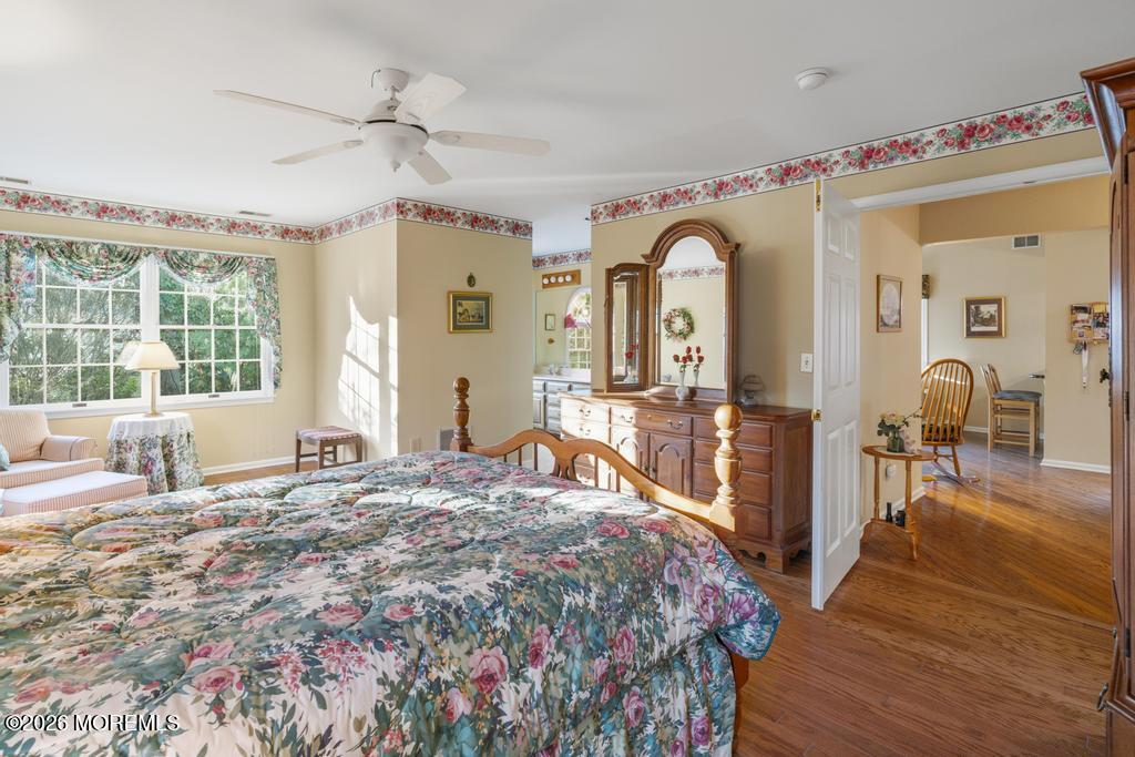 2287 Coral Leaf Road Toms River, NJ 08755 - Photo 21 of 38 a bedroom with a bed and wooden floor