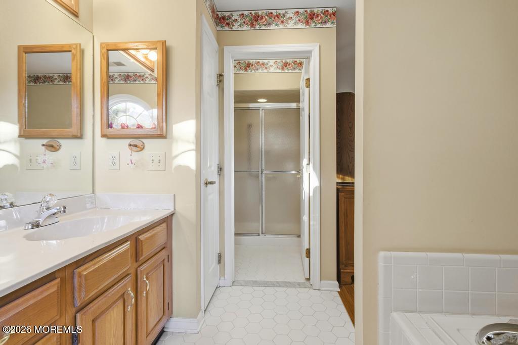 2287 Coral Leaf Road Toms River, NJ 08755 - Photo 26 of 38 a bathroom with a granite countertop sink and a mirror