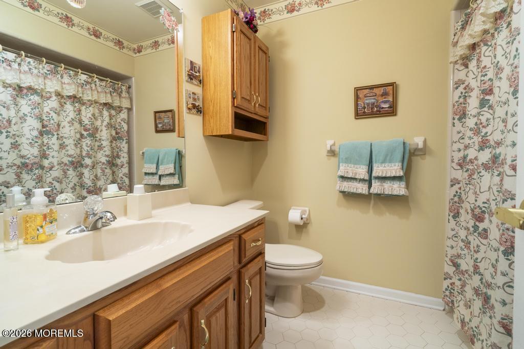2287 Coral Leaf Road Toms River, NJ 08755 - Photo 27 of 38 a bathroom with a sink toilet and shower