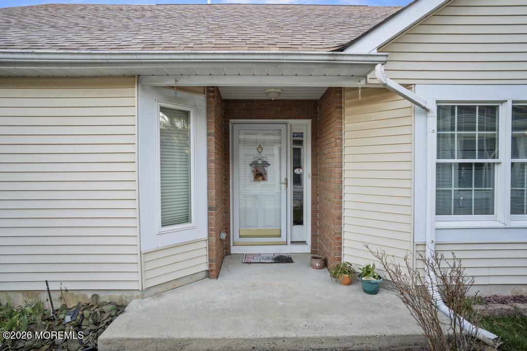 2287 Coral Leaf Road Toms River, NJ 08755 - Photo 3 of 38 a front view of a house with a garden