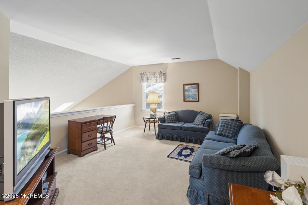 2287 Coral Leaf Road Toms River, NJ 08755 - Photo 31 of 38 a living room with furniture and a flat screen tv