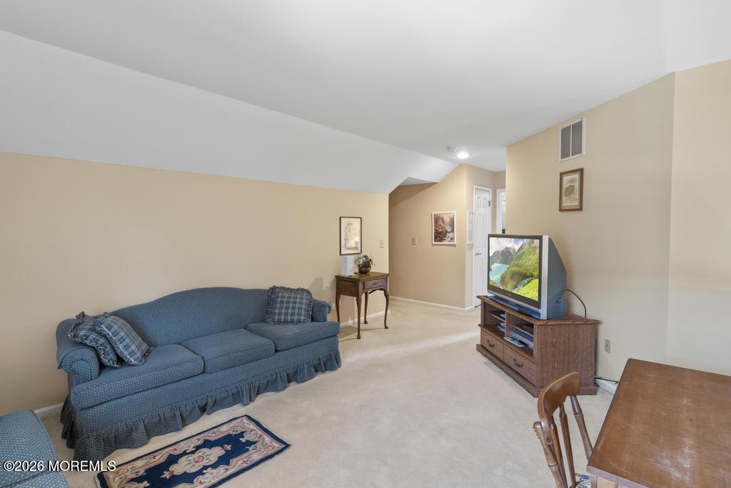 2287 Coral Leaf Road Toms River, NJ 08755 - Photo 32 of 38 a living room with furniture and a flat screen tv