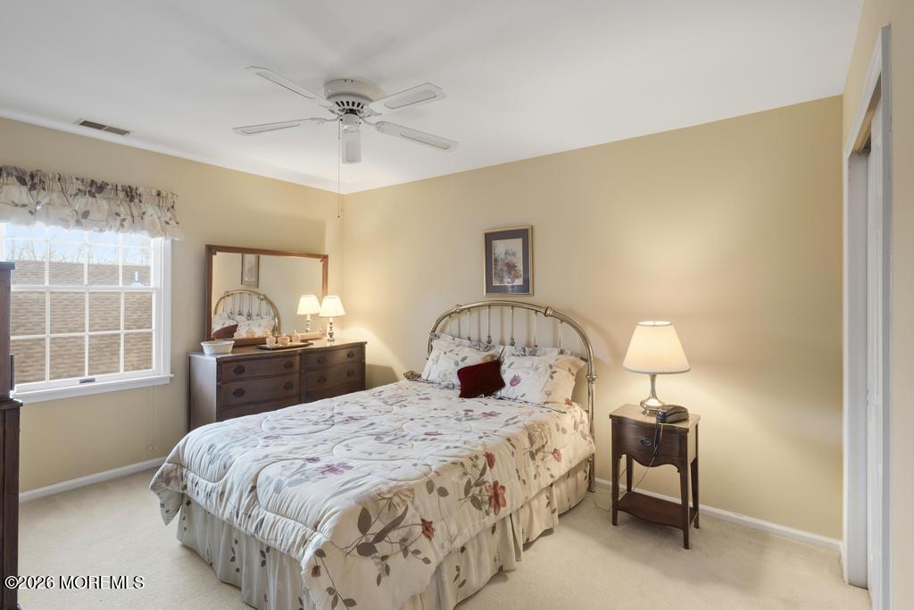 2287 Coral Leaf Road Toms River, NJ 08755 - Photo 34 of 38 a bedroom with a bed and a table