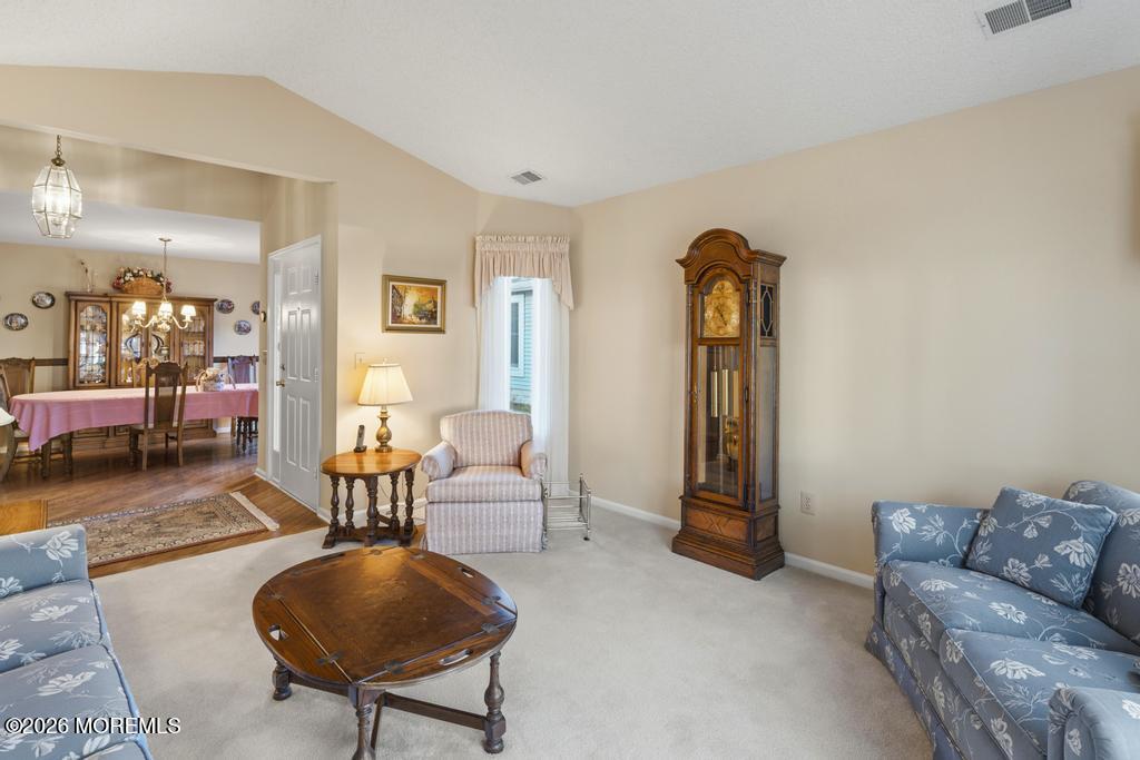 2287 Coral Leaf Road Toms River, NJ 08755 - Photo 7 of 38 a living room with furniture and a lamp