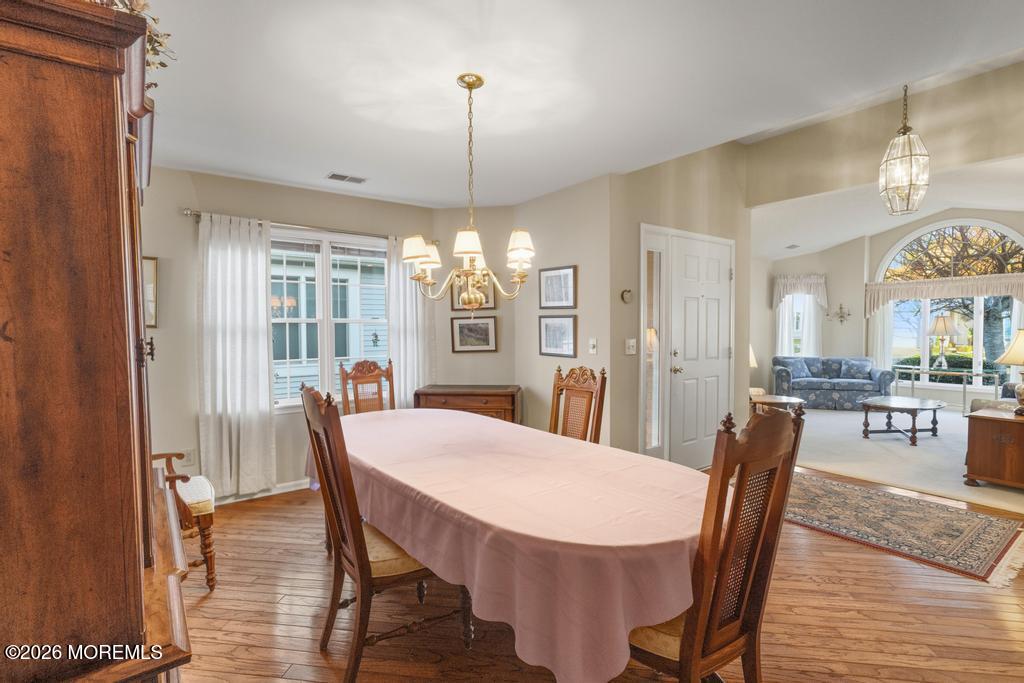 2287 Coral Leaf Road Toms River, NJ 08755 - Photo 10 of 38 a view of a dining room with furniture window and wooden floor