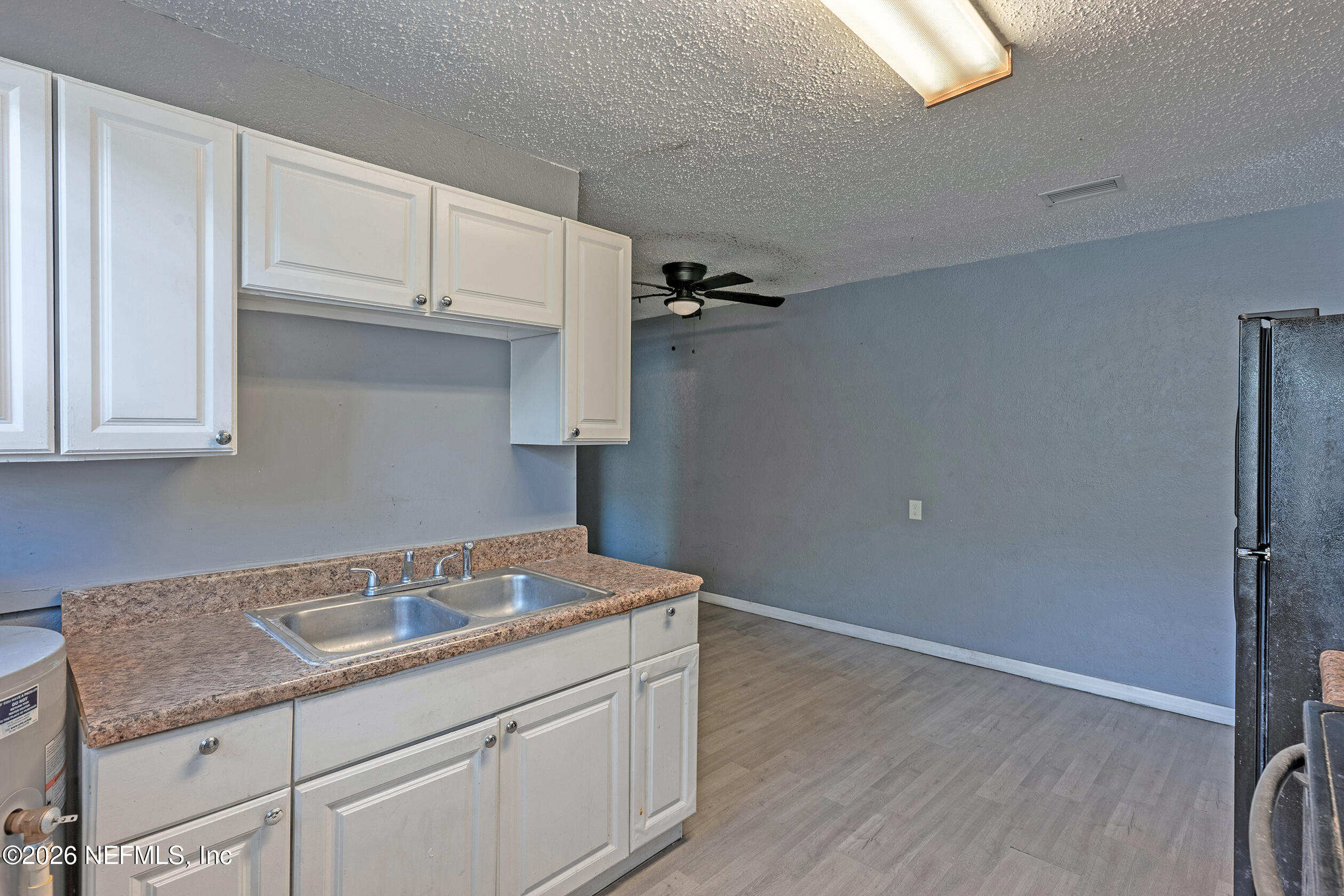 4114 Moncrief Road Jacksonville, FL 32209 - Photo 15 of 42 a kitchen with a sink cabinets and a window