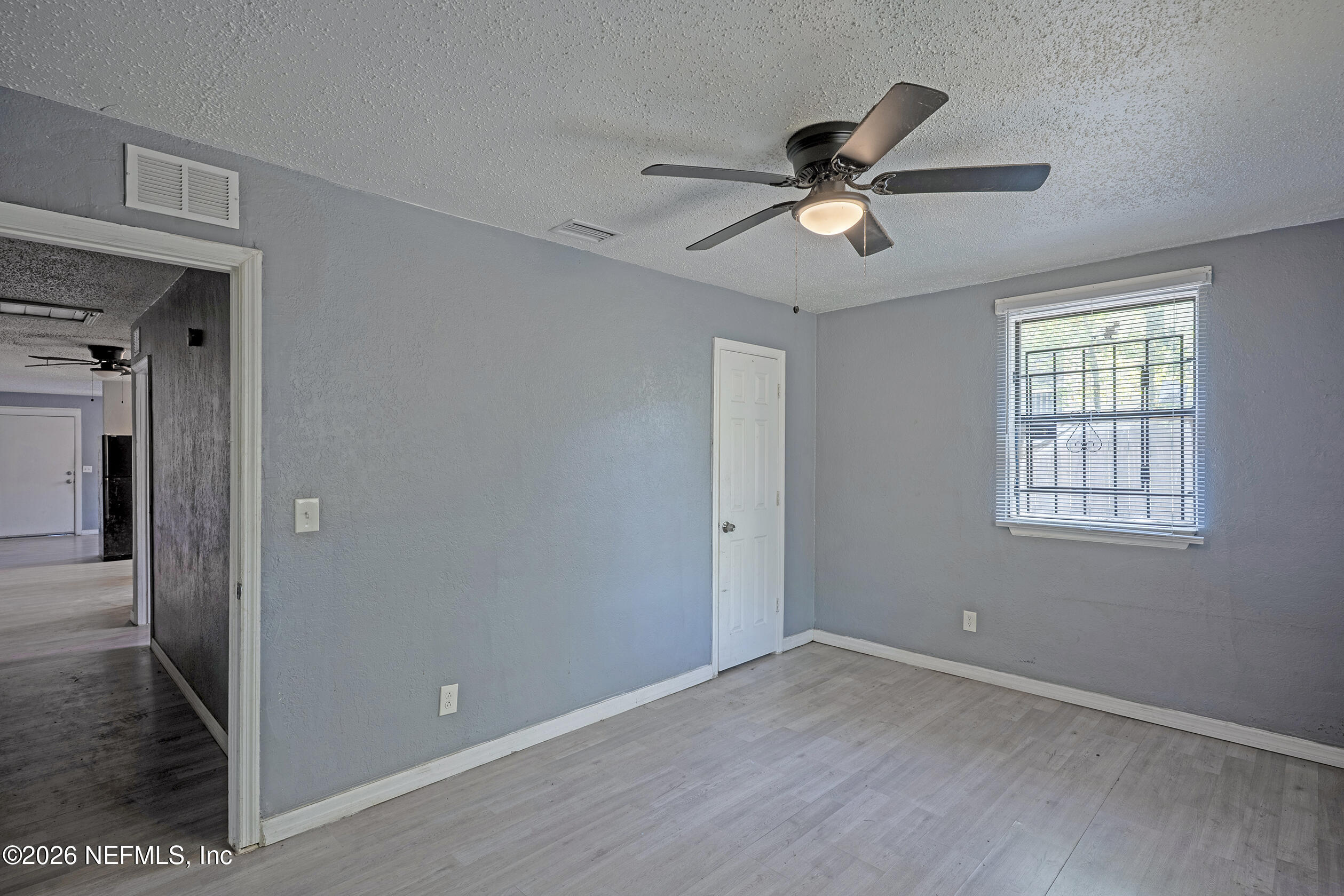 4114 Moncrief Road Jacksonville, FL 32209 - Photo 22 of 42 a view of empty room with wooden floor