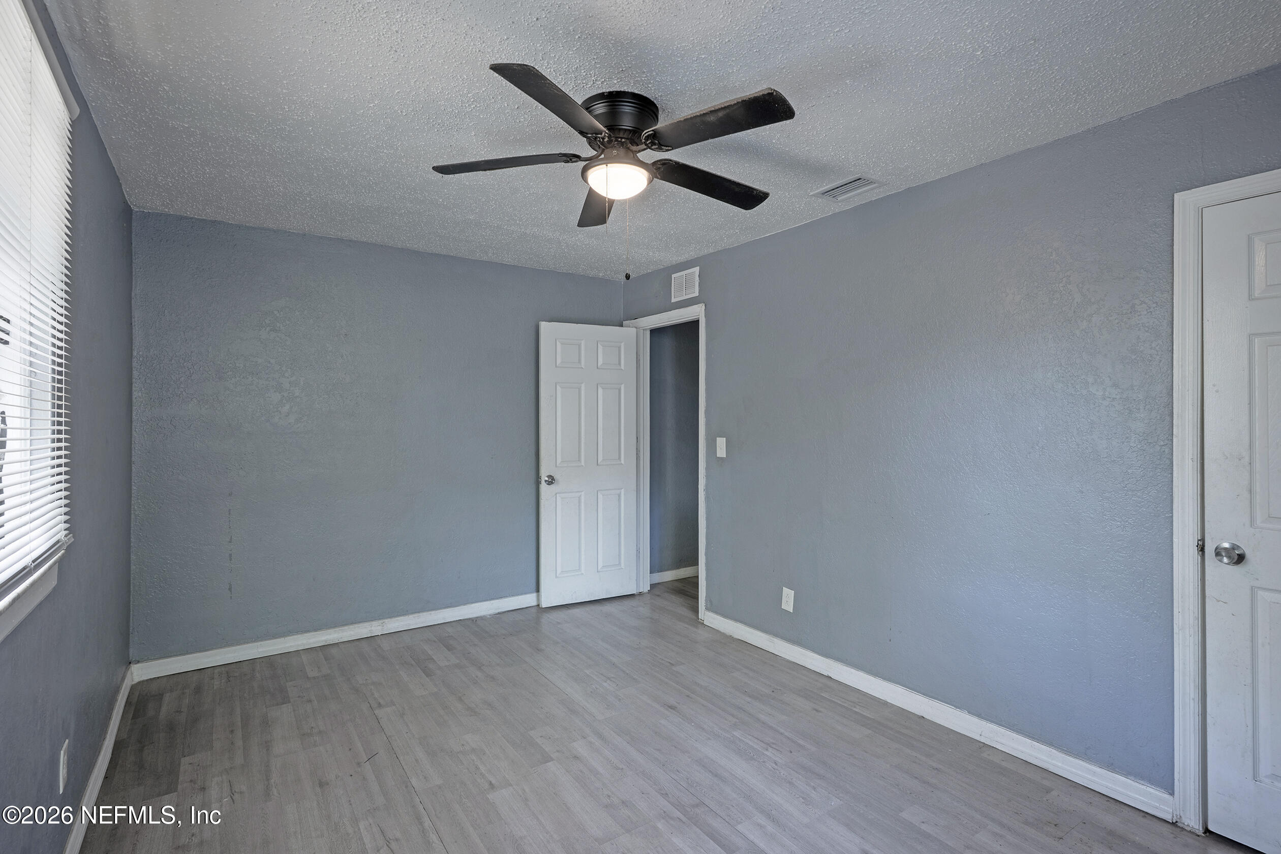 4114 Moncrief Road Jacksonville, FL 32209 - Photo 23 of 42 wooden floor in an empty room