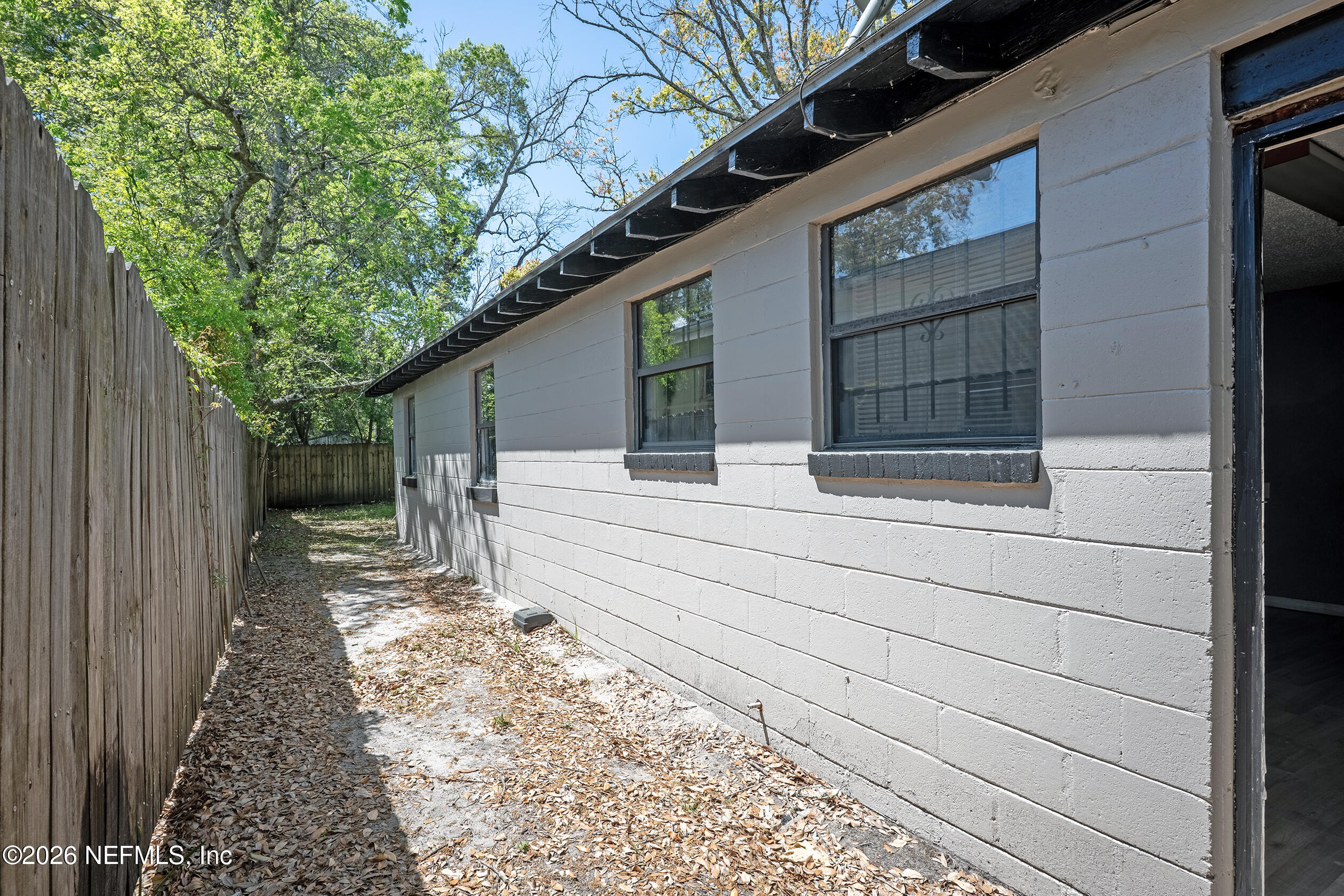 4114 Moncrief Road Jacksonville, FL 32209 - Photo 25 of 42 a house with trees in front of it