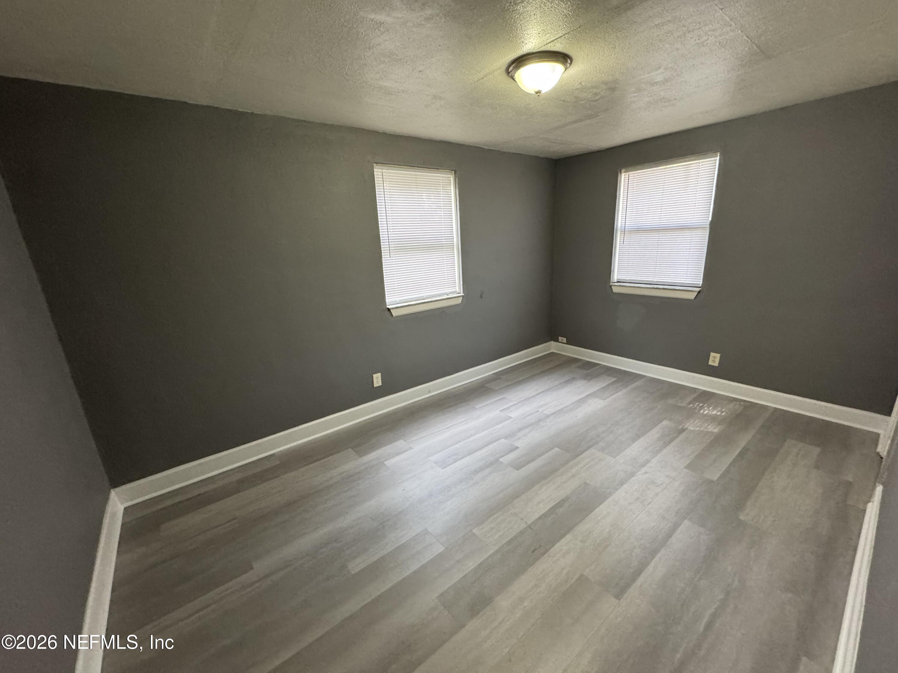 4114 Moncrief Road Jacksonville, FL 32209 - Photo 34 of 42 an empty room with windows