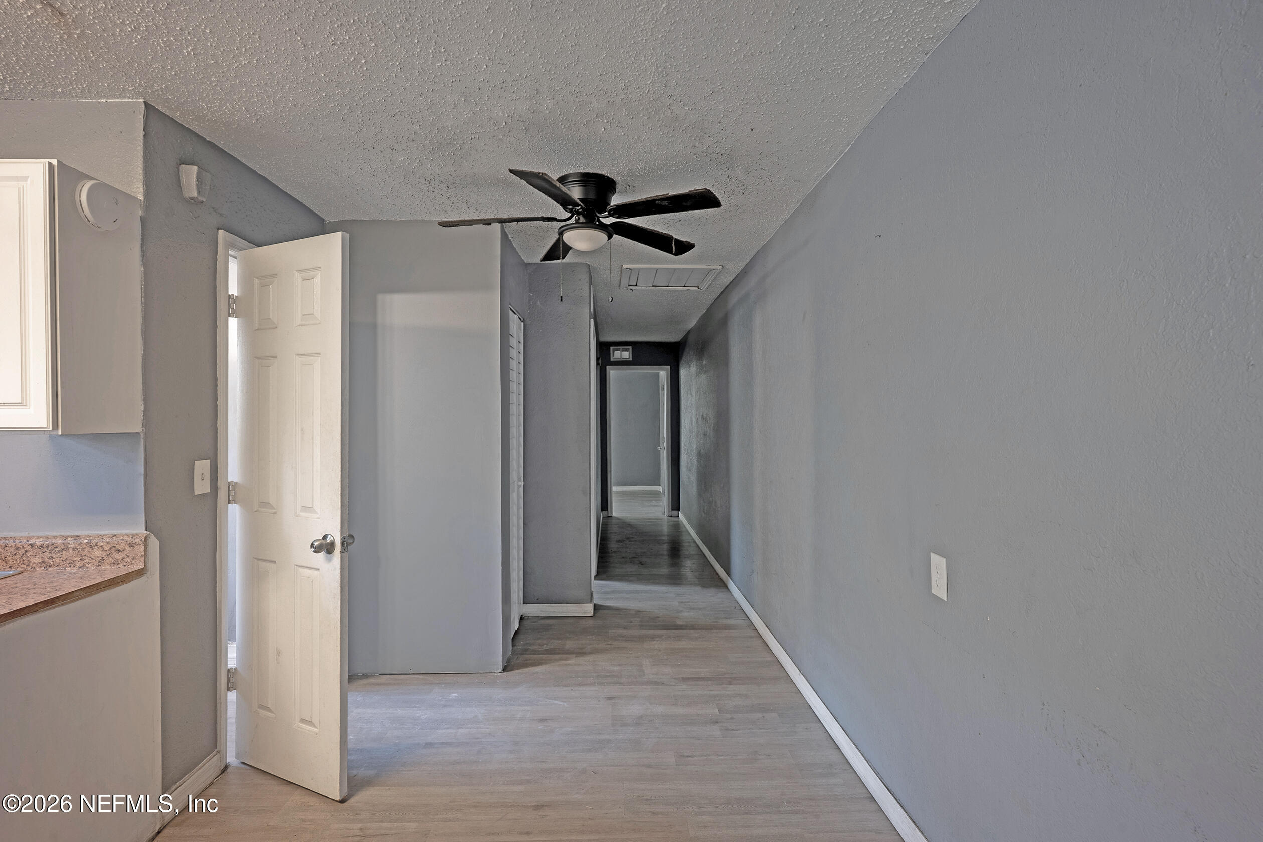4114 Moncrief Road Jacksonville, FL 32209 - Photo 9 of 42 a view of a hallway with a chandelier