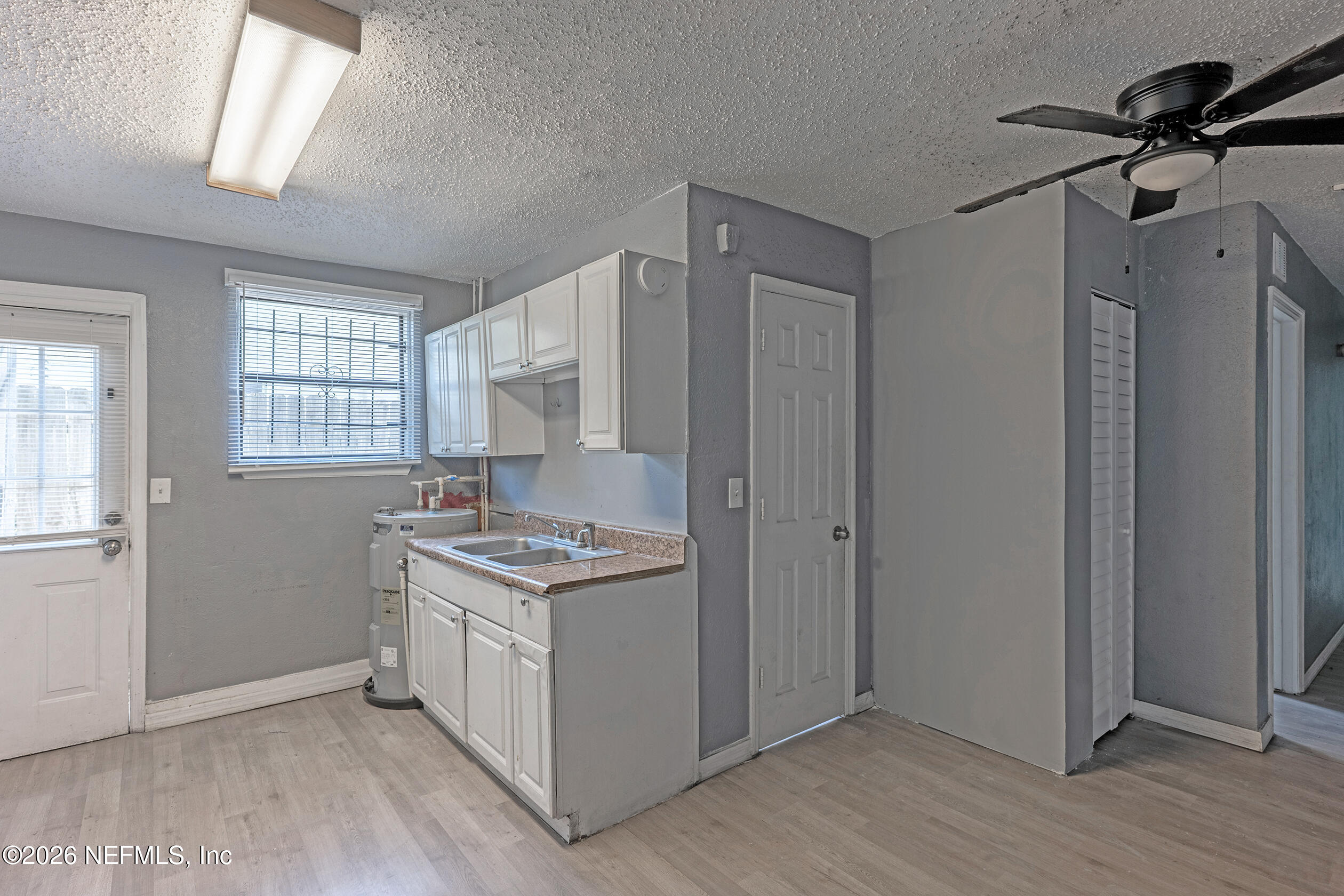 4114 Moncrief Road Jacksonville, FL 32209 - Photo 10 of 42 a kitchen with stainless steel appliances granite countertop a stove and a refrigerator