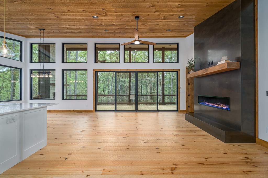 221 Goldmine Road Morganton, GA 30560 - Photo 14 of 51 a view of empty room with wooden floor and fireplace
