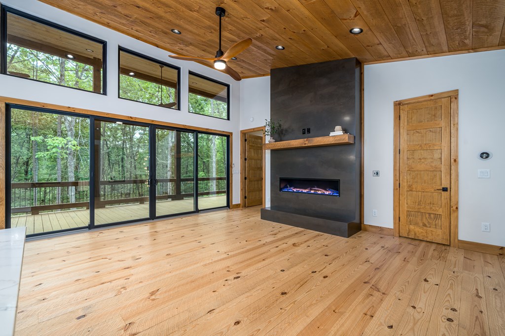 221 Goldmine Road Morganton, GA 30560 - Photo 15 of 51 a view of an empty room with a fireplace and a window