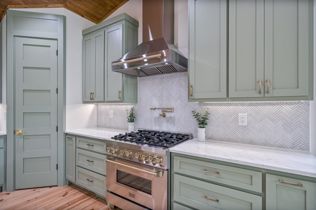 221 Goldmine Road Morganton, GA 30560 - Photo 19 of 51 a kitchen with a stove and cabinets