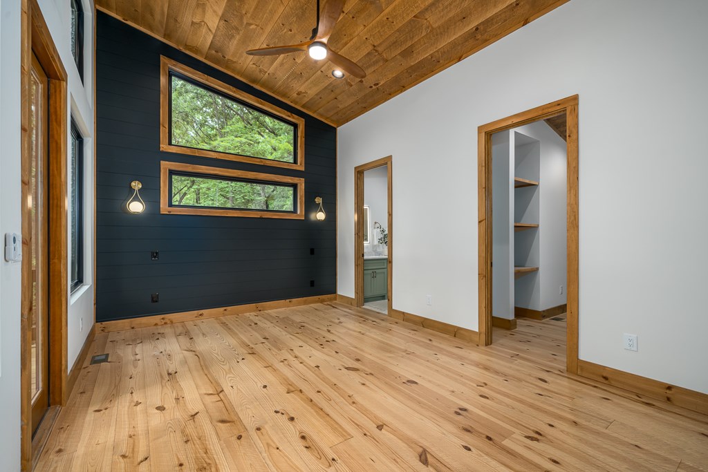 221 Goldmine Road Morganton, GA 30560 - Photo 22 of 51 a view of an empty room with a window and wooden floor