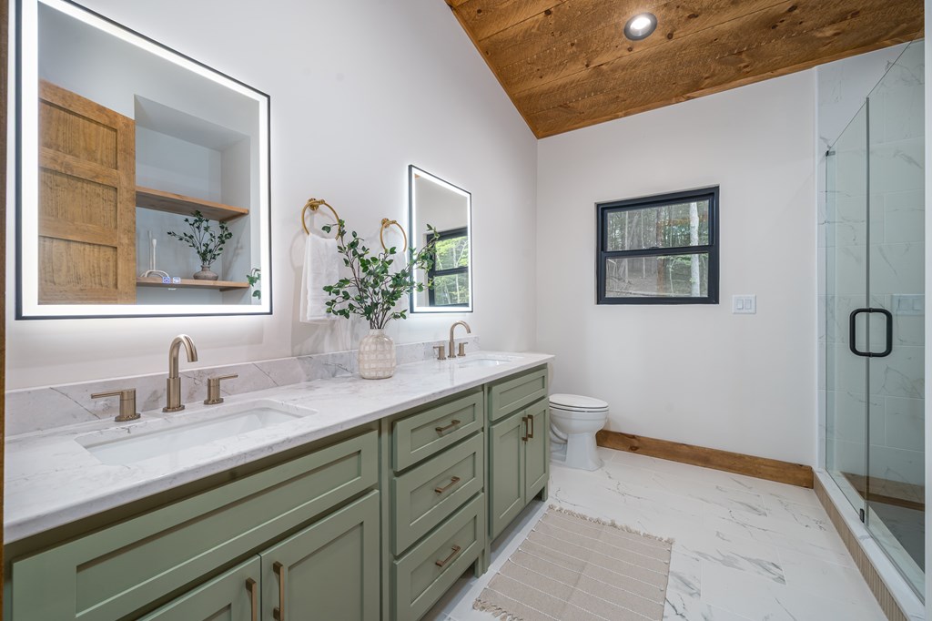 221 Goldmine Road Morganton, GA 30560 - Photo 25 of 51 a bathroom with a double vanity sink and a mirror