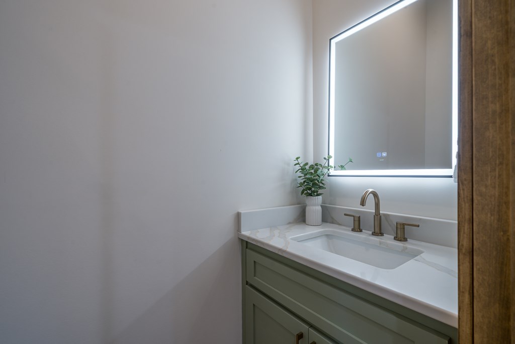 221 Goldmine Road Morganton, GA 30560 - Photo 30 of 51 a bathroom with a granite countertop sink and a mirror