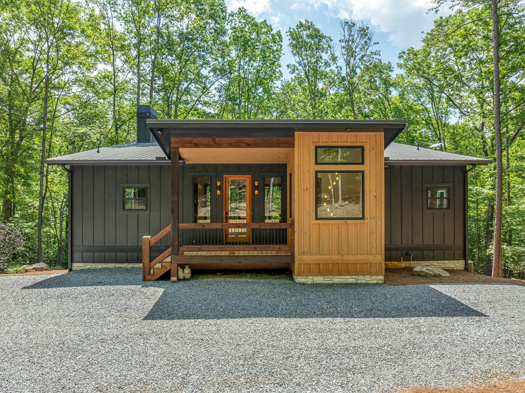 221 Goldmine Road Morganton, GA 30560 - Photo 3 of 51 a front view of a house with a garden