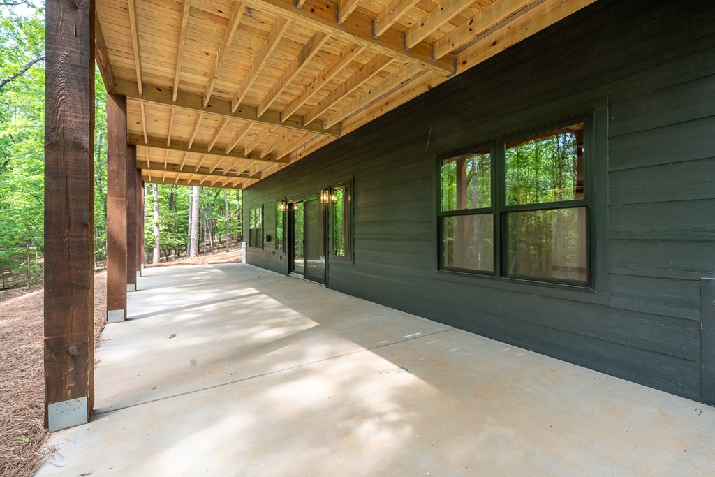 221 Goldmine Road Morganton, GA 30560 - Photo 48 of 51 a view of backyard with large window and wooden fence