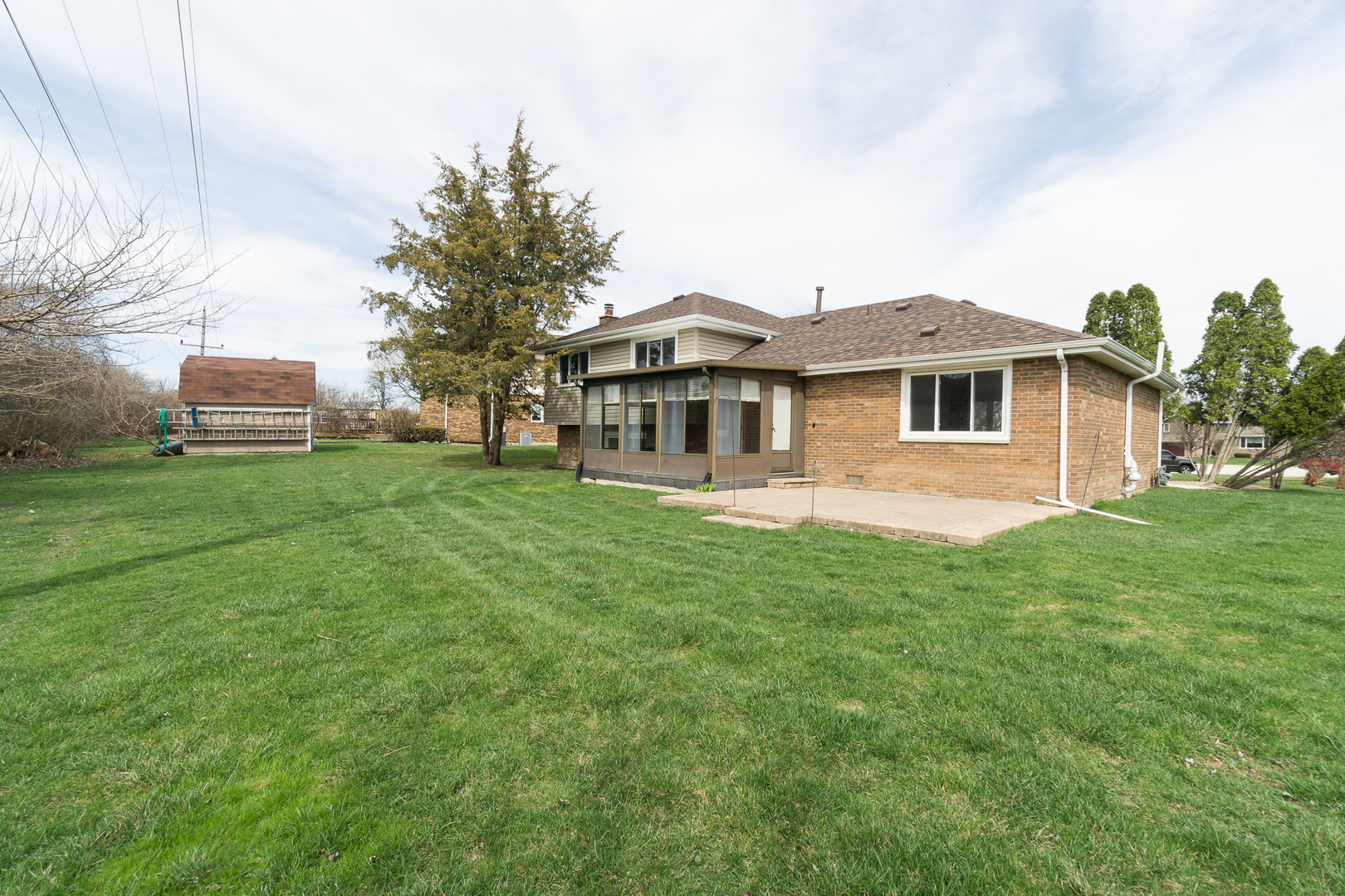 87 Timberline Drive Lemont, IL 60439 - Photo 26 of 27 a front view of a house with a garden