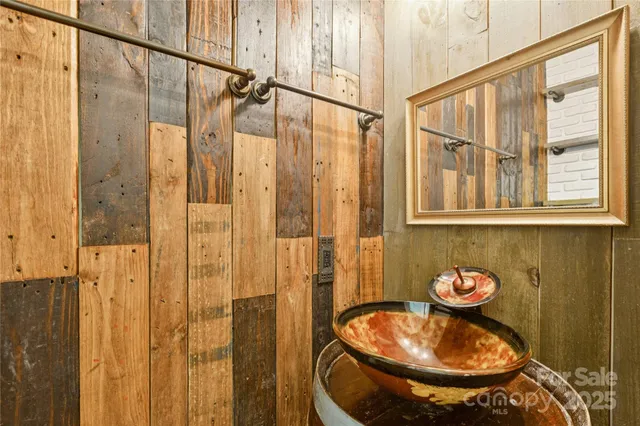 a view of an empty room with a fireplace and a window