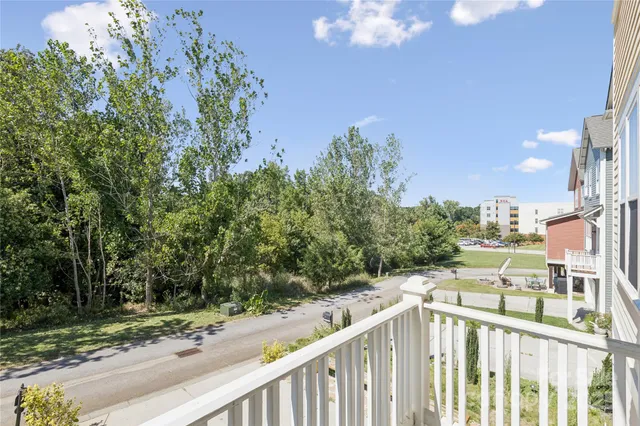 a front view of a house with a garden and yard