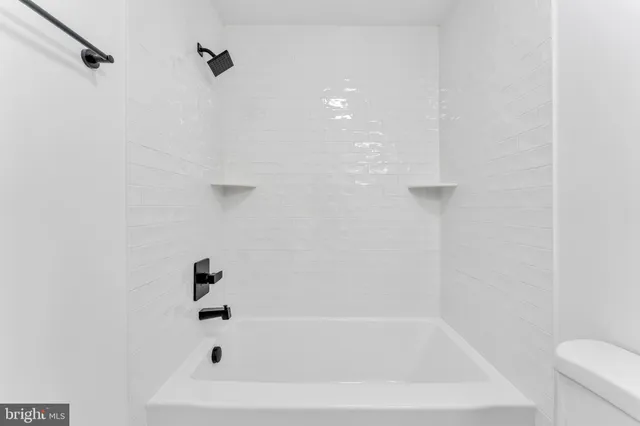 a close up of a bathtub curtain