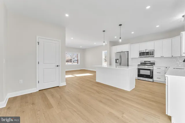 a view of kitchen with wooden floor