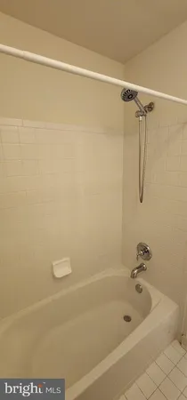 a bathroom with a shower and a bathtub