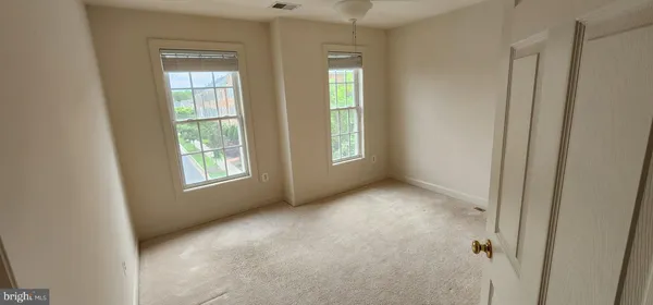 an empty room with fireplace