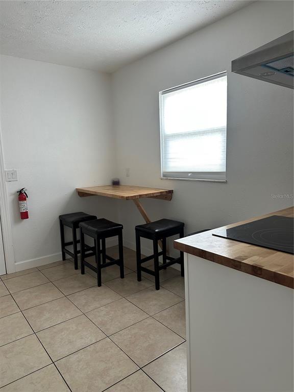 1909 West Green Street Tampa, FL 33607 - Photo 5 of 9 a room with furniture a window and a table